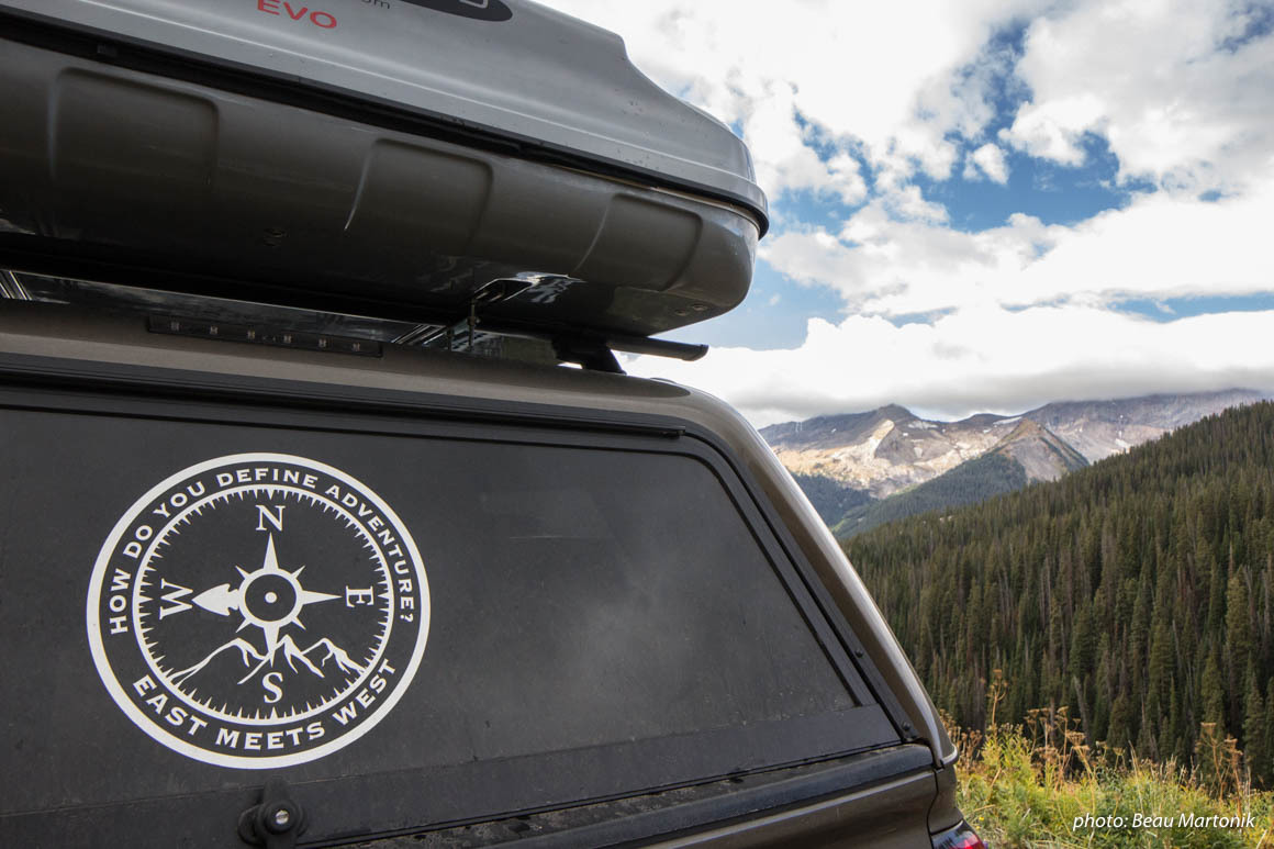 East Meets West truck with logo in mountains. East Meets West truck with logo in mountains.