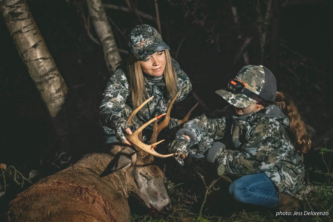 Mother and daughter hunting with whitetail buck in the Northeast. Mother and daughter hunting with whitetail buck in the Northeast.