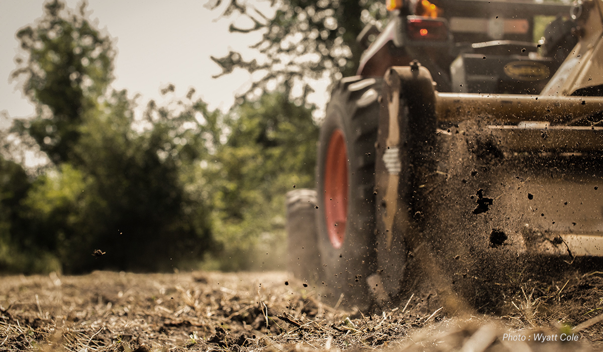 A tractor breaks ground. A tractor breaks ground.