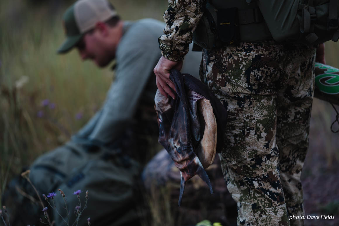 Two friends hunt antelope together during a Montana dawn. Two friends hunt antelope together during a Montana dawn.
