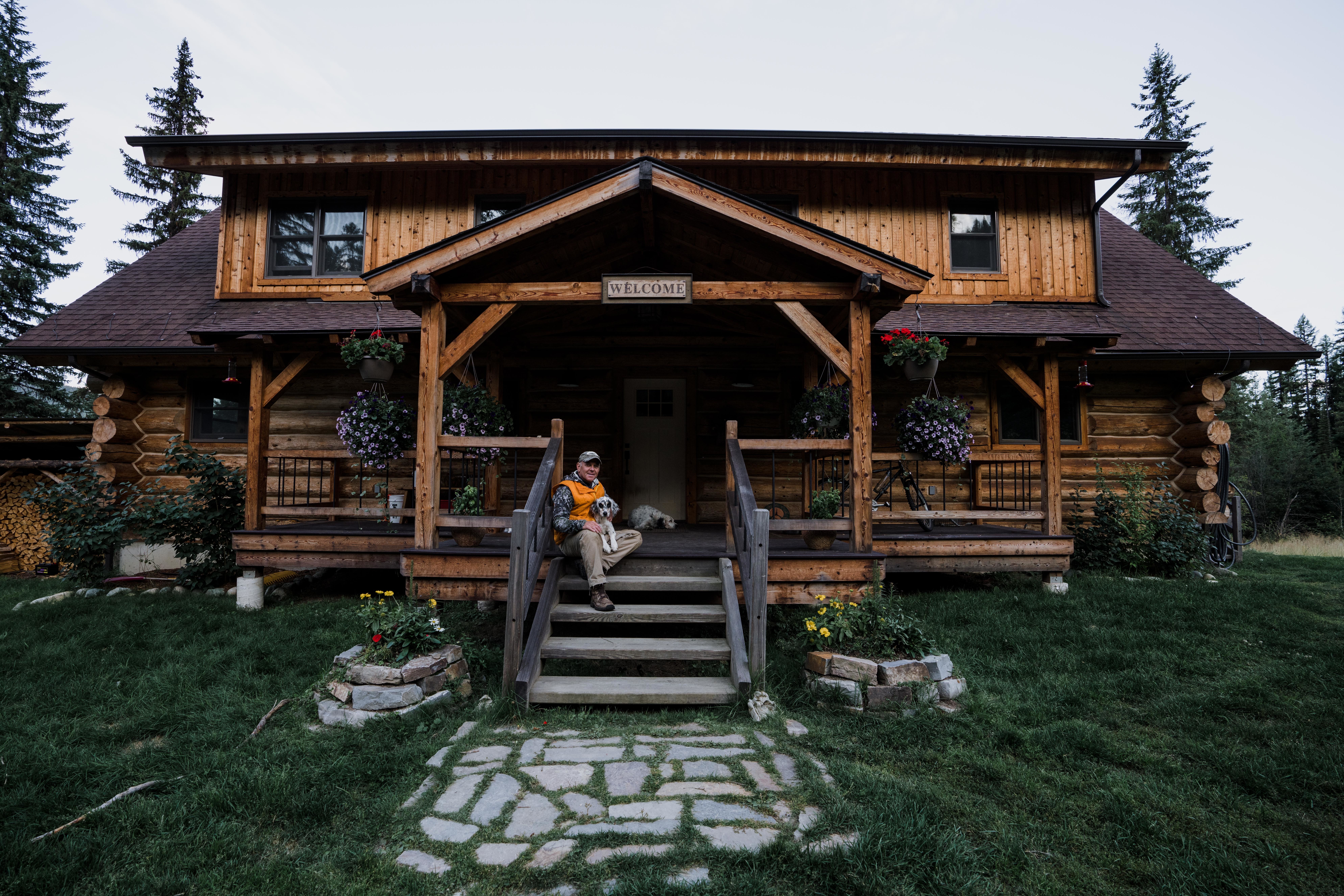 Montana outfitter Tim Linehan sits on his porch with his setters. Montana outfitter Tim Linehan sits on his porch with his setters.