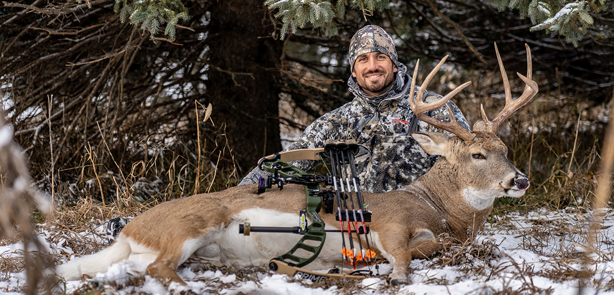 Sam Soholt with an archery deer harvested in the snow. Sam Soholt with an archery deer harvested in the snow.