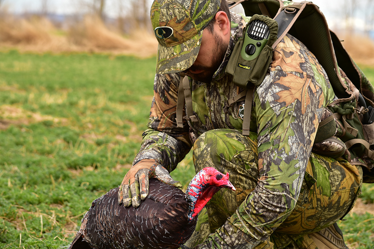Man in camouflage placing a turkey decoy while hunting near Colorado Springs, Colorado. Man in camouflage placing a turkey decoy while hunting near Colorado Springs, Colorado.
