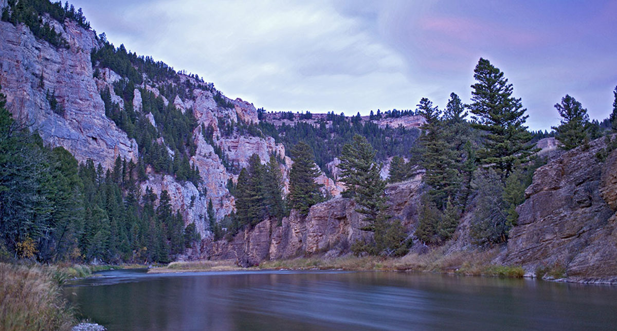Image of the Smith River in Montana, with craggy cliffs, river and sky at sunrise. Image of the Smith River in Montana, with craggy cliffs, river and sky at sunrise.