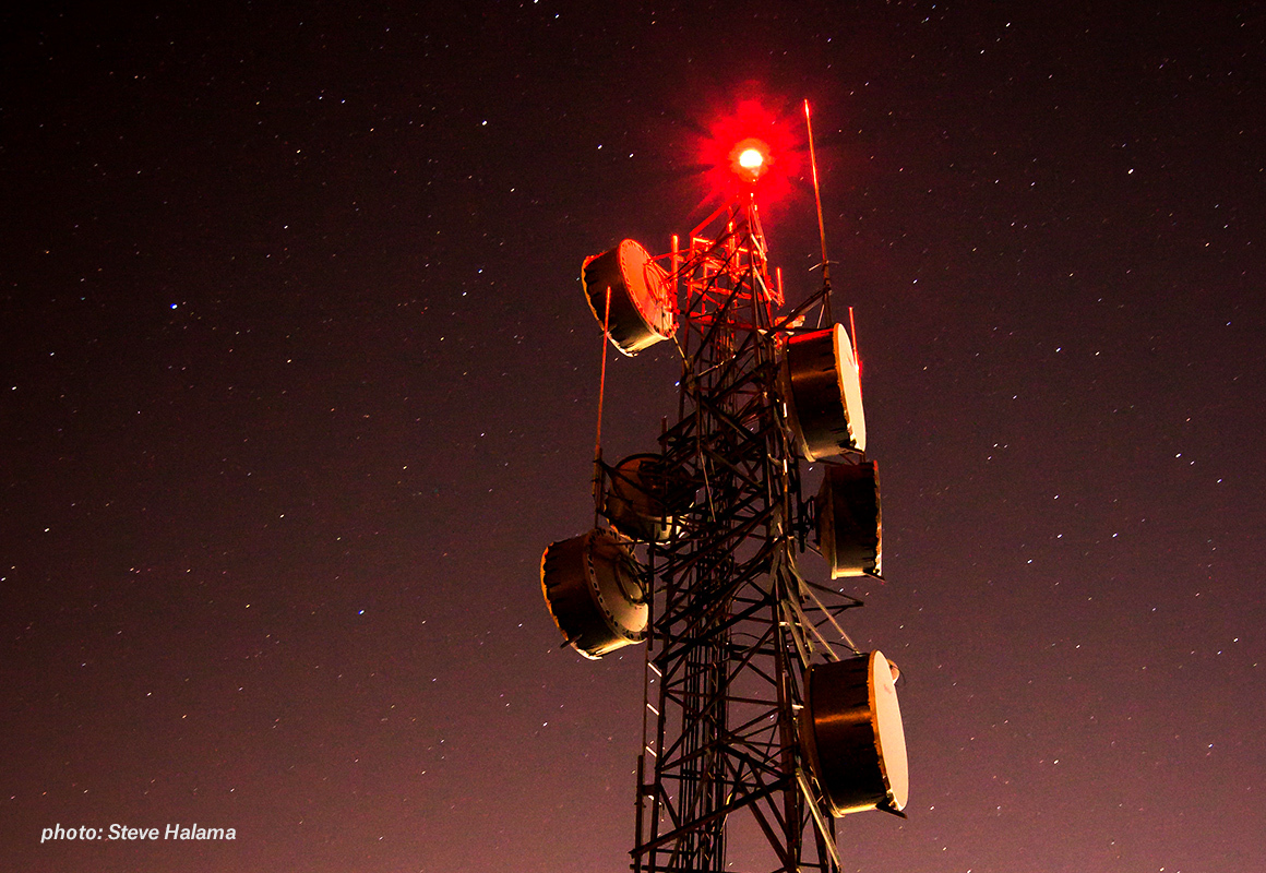 Cell tower with night sky background Cell tower with night sky background