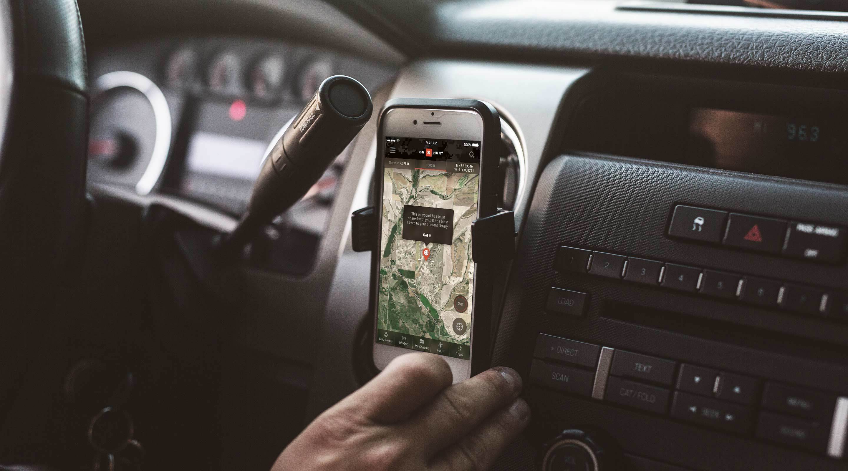 onX Hunt App shown on mobile device and mounted in truck cab. onX Hunt App shown on mobile device and mounted in truck cab.